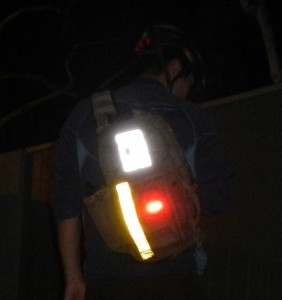 I use a yellow reflective strip, a white reflective plate, and a red blinker (Blackburn Flea)