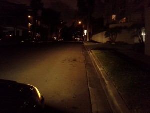 Using a car's headlights to help illuminate the road ahead.